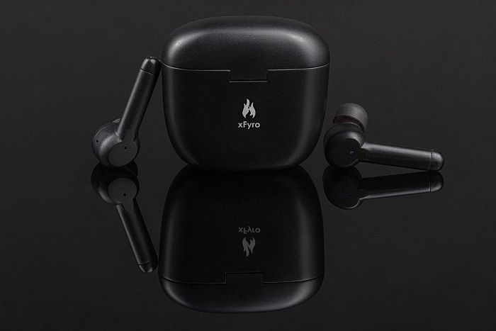 a set of xfyro headphones  and case on a reflective black background