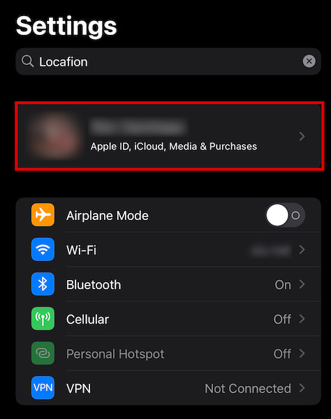 Tapping on your profile inside the settings app to access iCloud