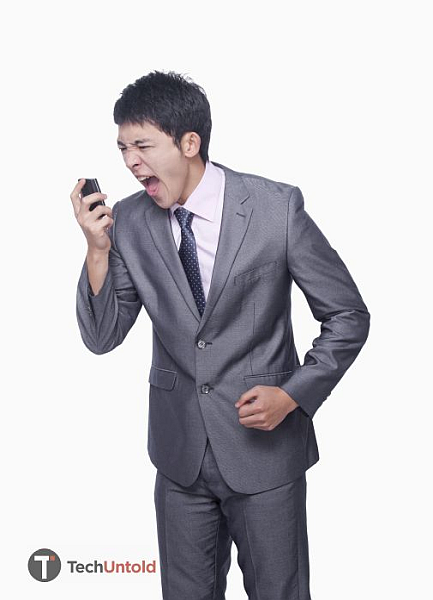 Angry boss yelling at the phone